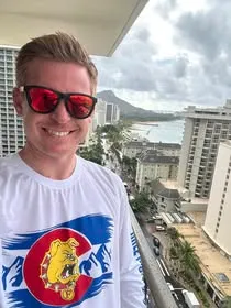 Supporter wearing a Ferris State Bulldogs shirt with a city view