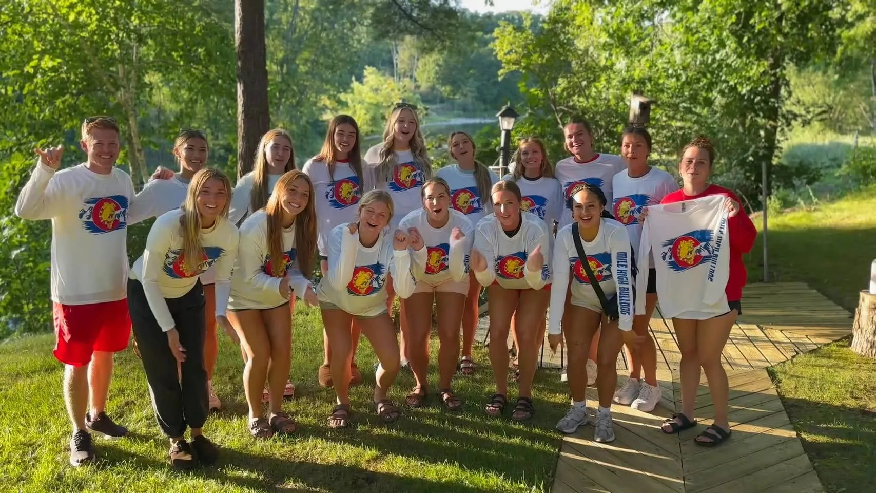 Mile High Bulldogs supporters wearing matching shirts at an outdoor gathering